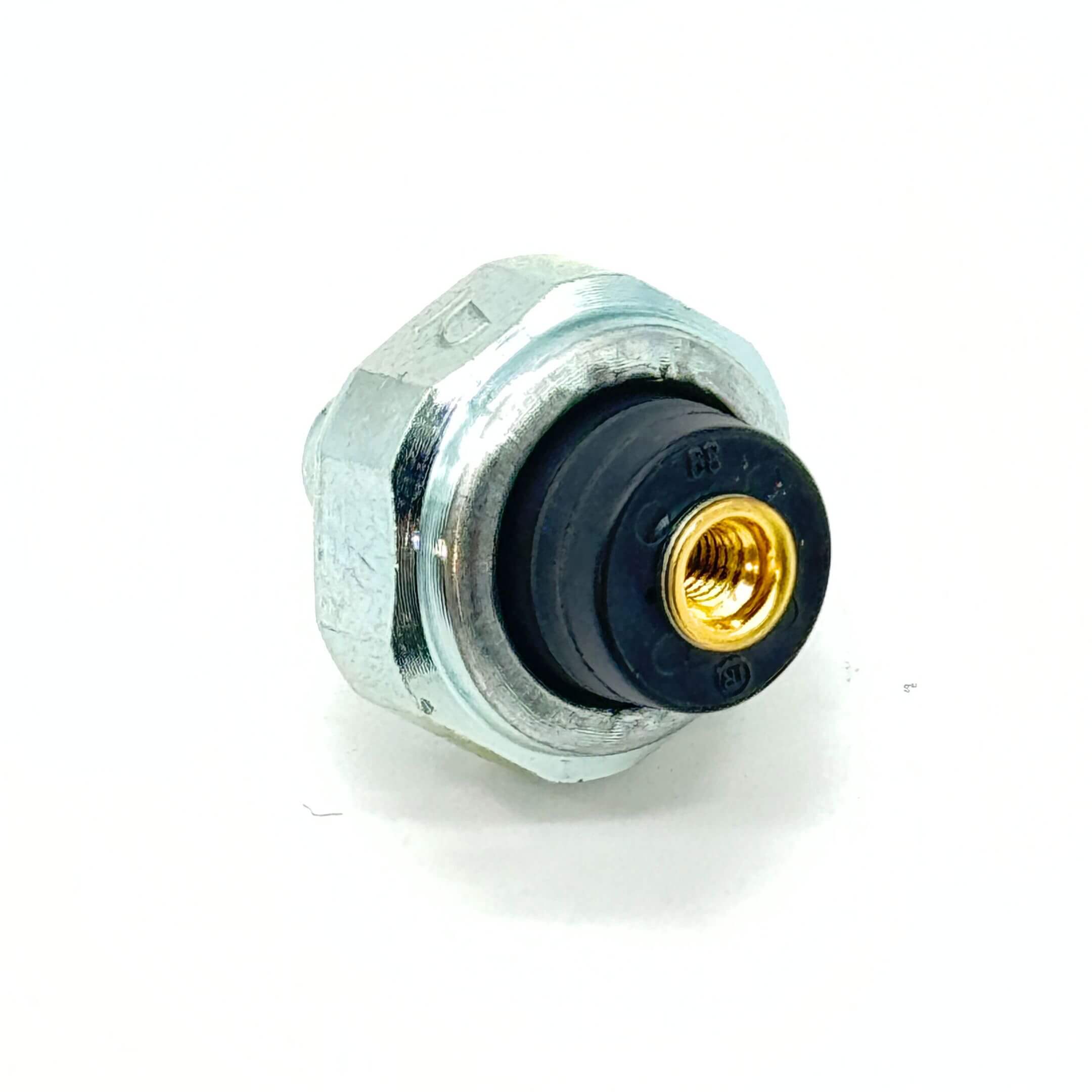 Angled view of Oil Pressure Switch with visible brass fitting for Honda Acty Van (1990-1999).