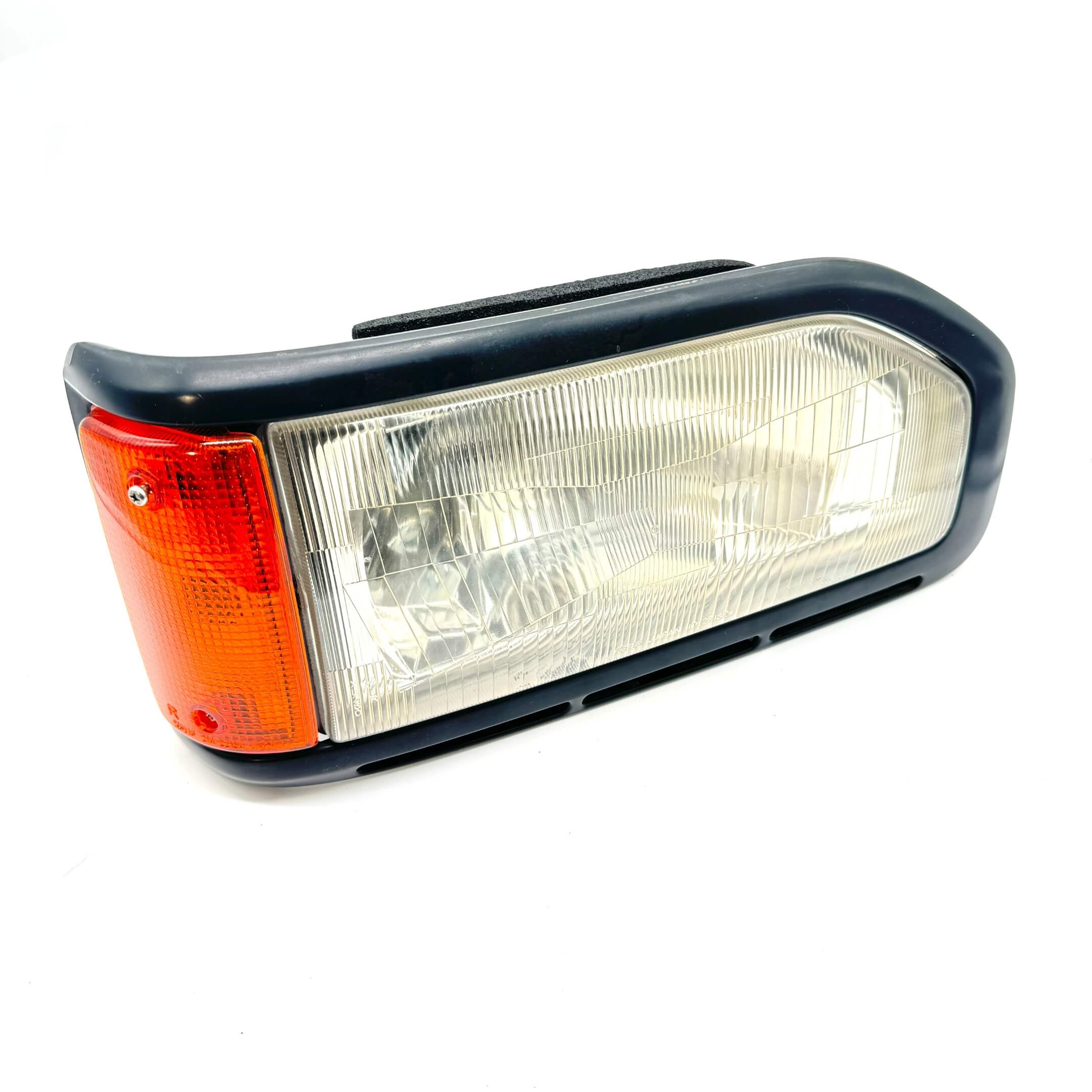 Right headlight assembly for Honda Acty Van HH3, HH4 models 1990-1993 with clear lens and orange indicator.