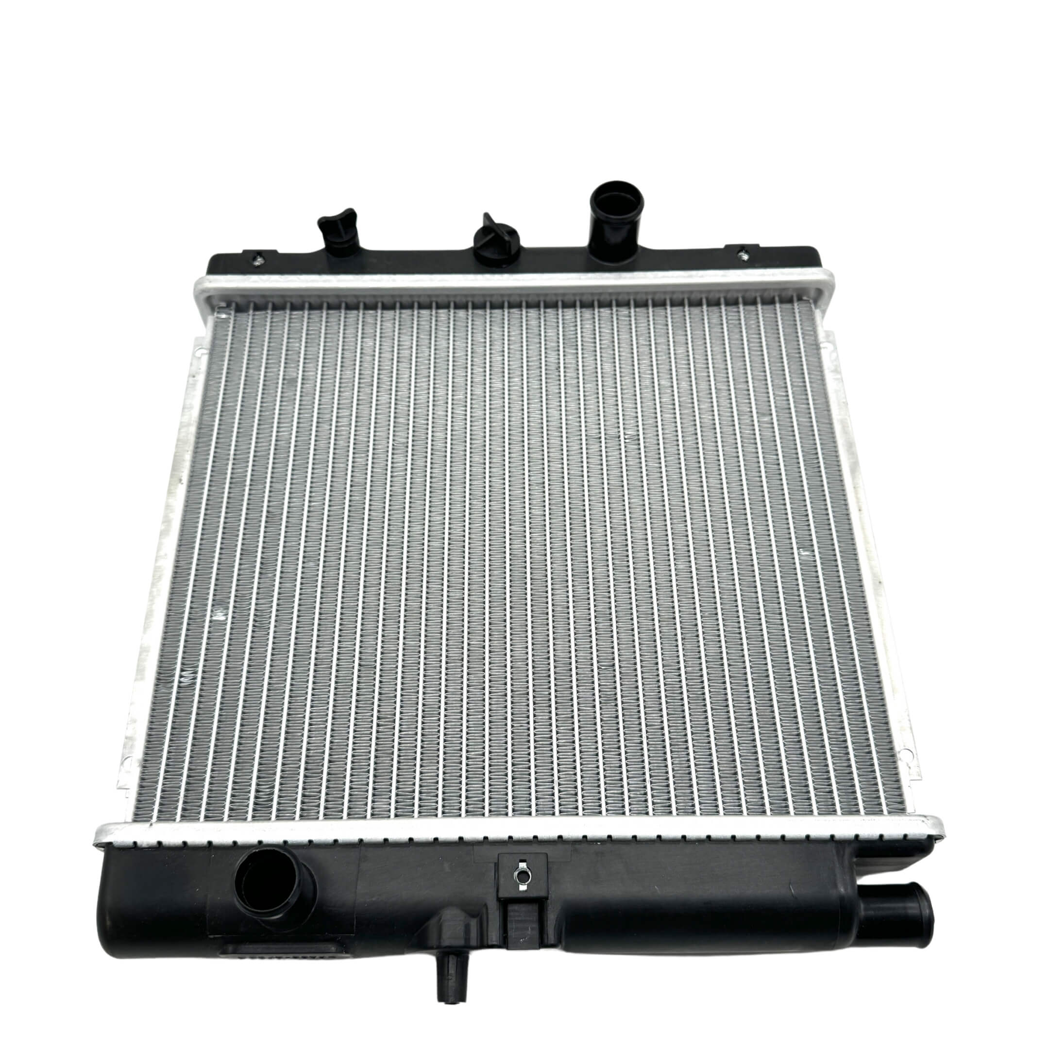 Side view of a Honda Acty HA3, HA4 radiator assembly, slightly used, with focus on side mounting brackets and clean fins.