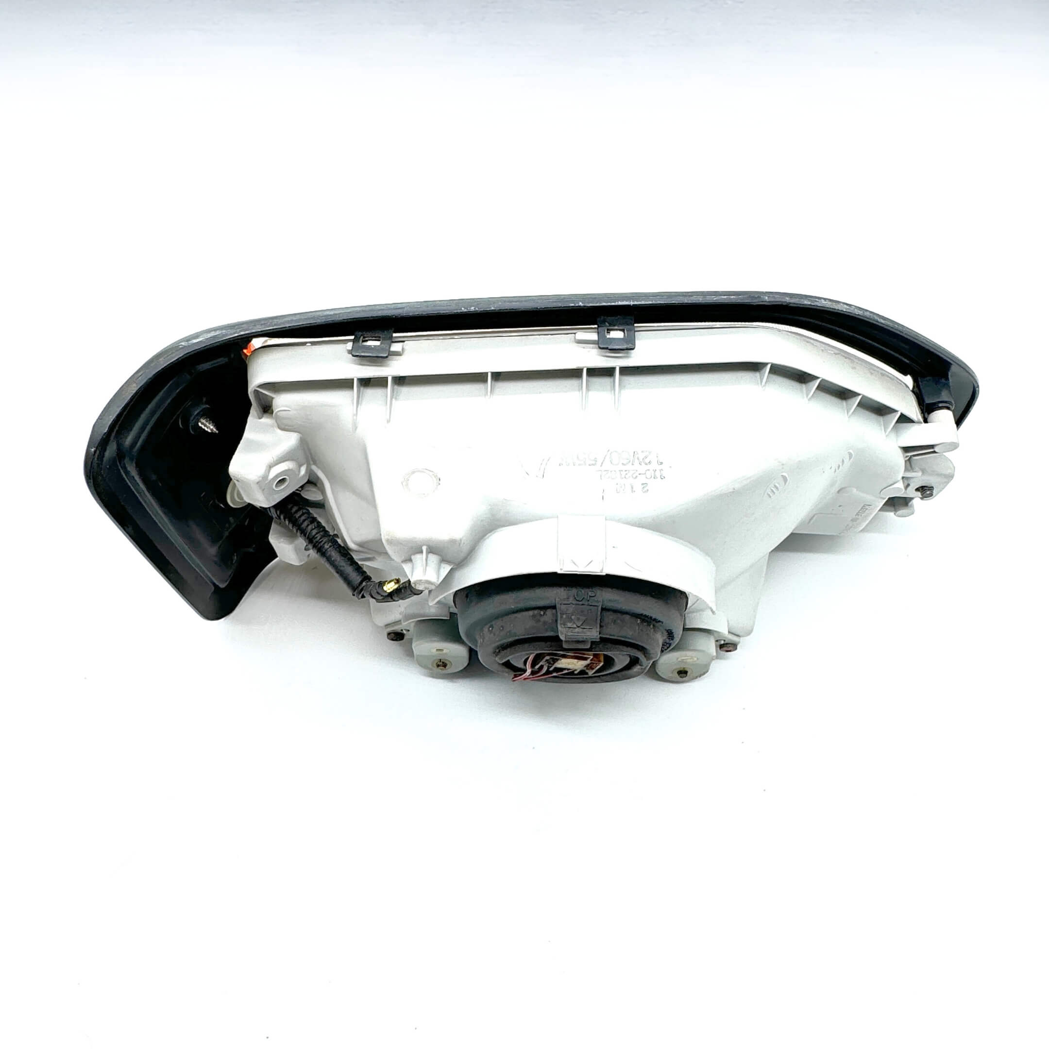 Backside view of Left Headlight Assembly for Honda Acty Van HH3, HH4 models (1990-1993) with detailed connector placement