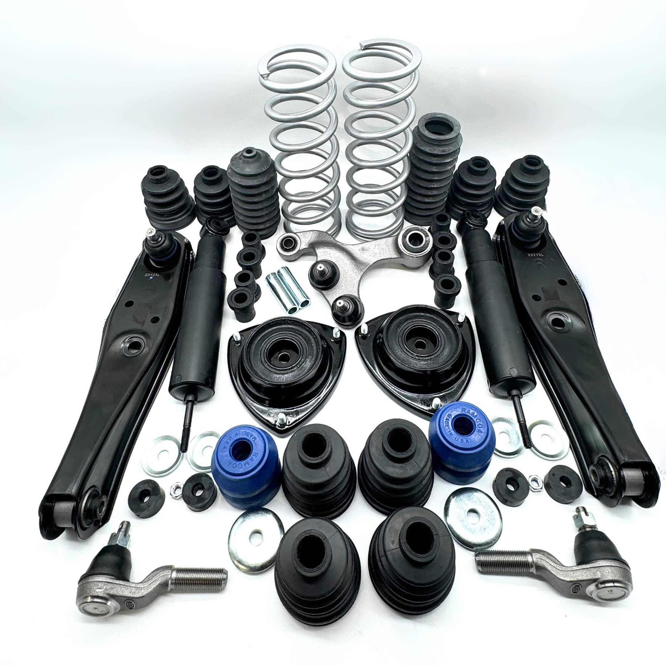 Complete suspension and steering upgrade kit displayed on white background, including springs, shock absorbers, control arms, for Honda Acty Van 1990-1999.
