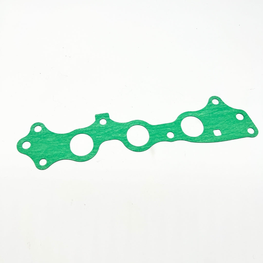 Intake manifold gasket for Honda Acty Truck HA3, HA4 models (1990-1999) - green gasket with multiple holes for precise fit and leak prevention
