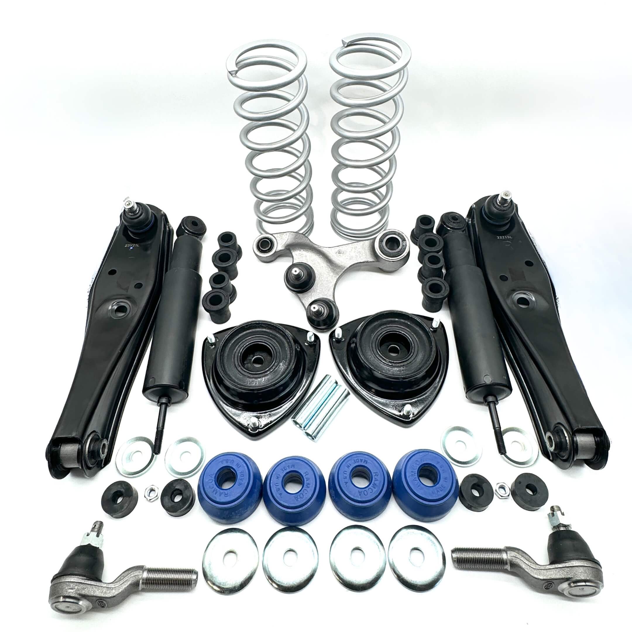 Complete suspension upgrade kit for Honda Acty HH3, HH4 1990-1999, featuring black shock absorbers, control arms, tie rods, and blue bushings.