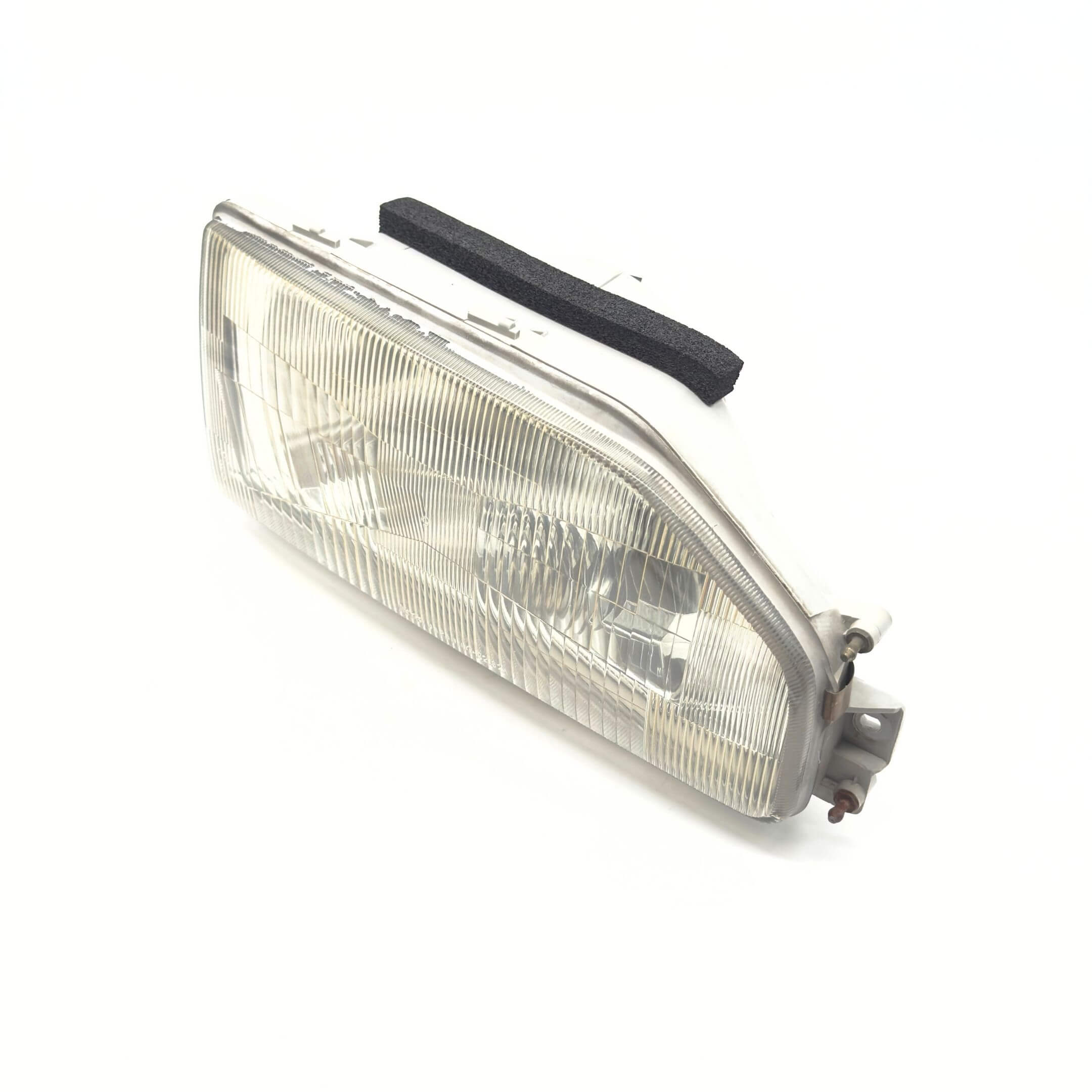 Headlight for Right/Driver Side of Honda Acty Truck Models HA3, HA4 (1990-1993) with clear lens and mounting hardware.