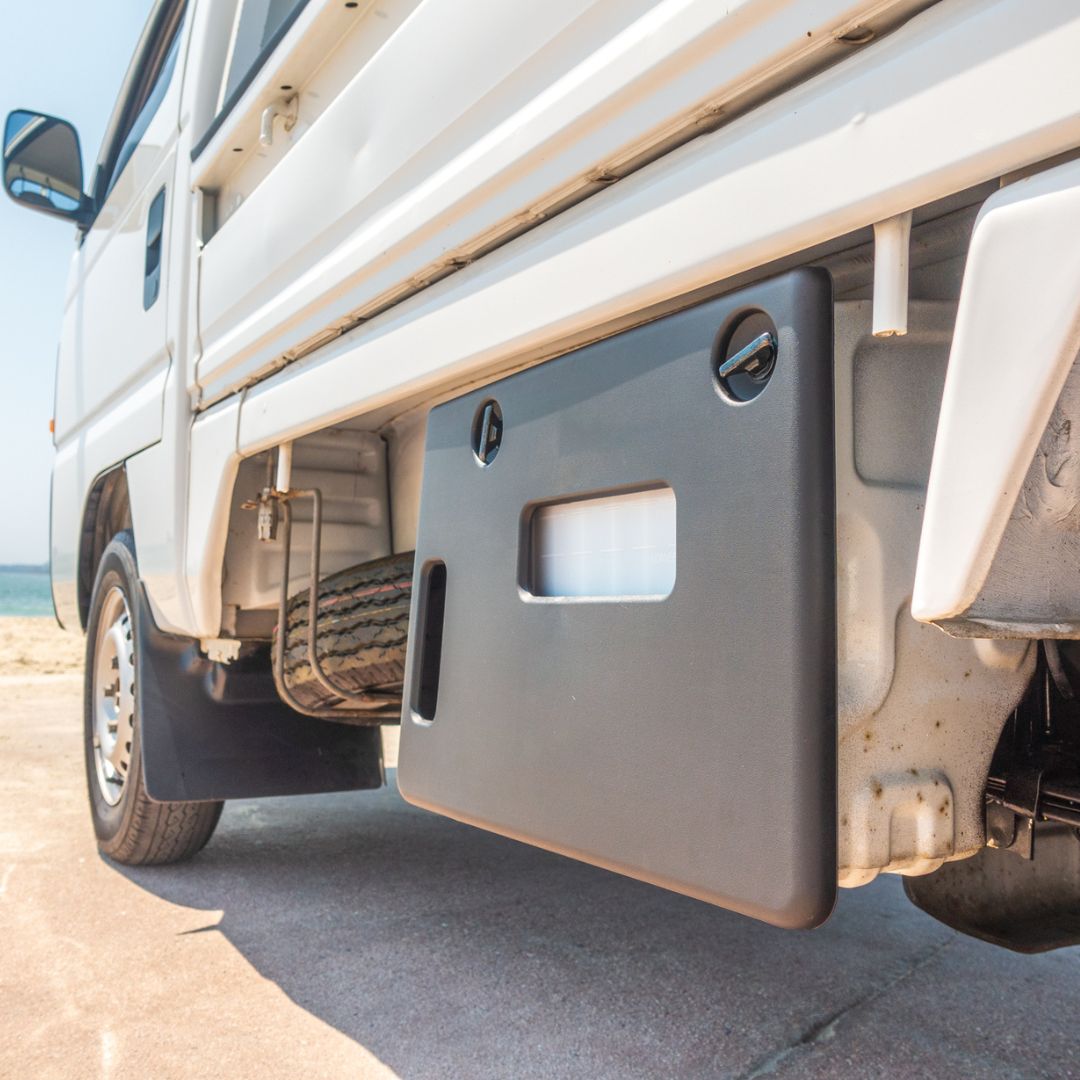 Installed Battery Box Cover on Honda Acty HA3, HA4 Models 1990-1999 | Precision-Cut and Durable | Protect Your Vehicle's Power Source | Genuine Mini Truck Parts at Oiwa Garage.