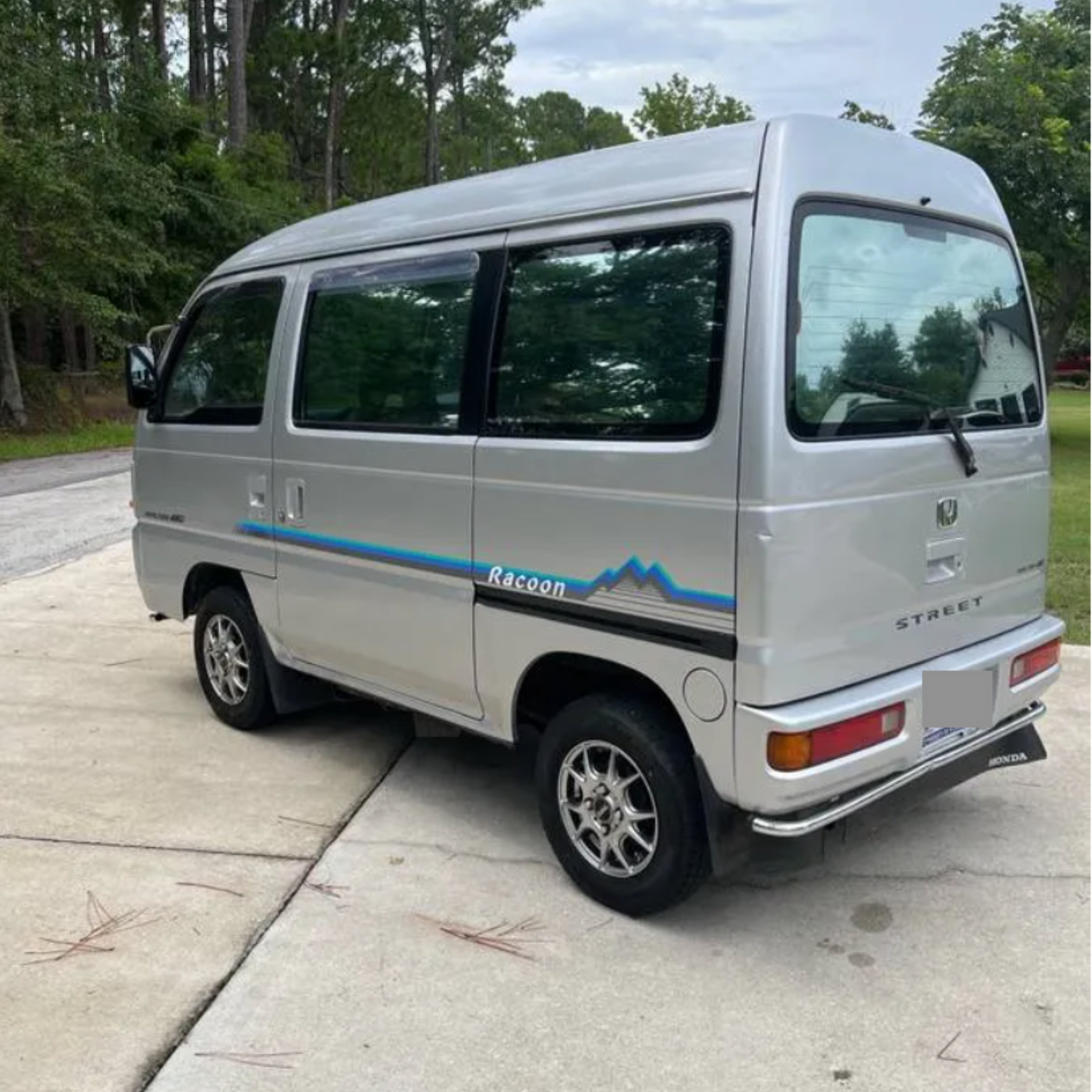 Honda Street Van with Racoon blue side decal showcasing rear placement on HH3, HH4 models from 1990 to 2000.
