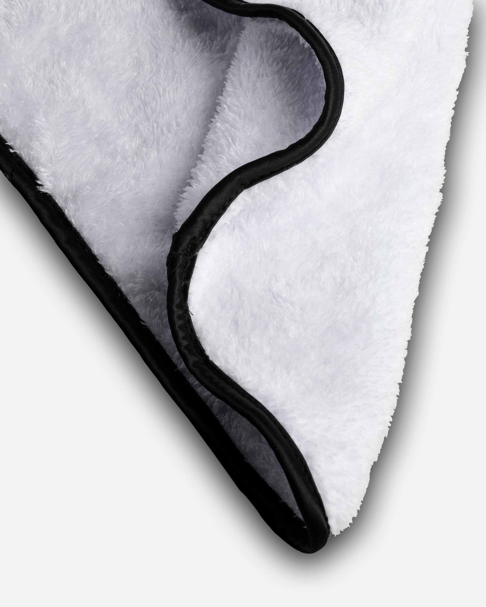 Microfiber Car Cloths close-up, revealing ultra-soft fibers and black edge trim that gently protect automotive paint during cleaning.