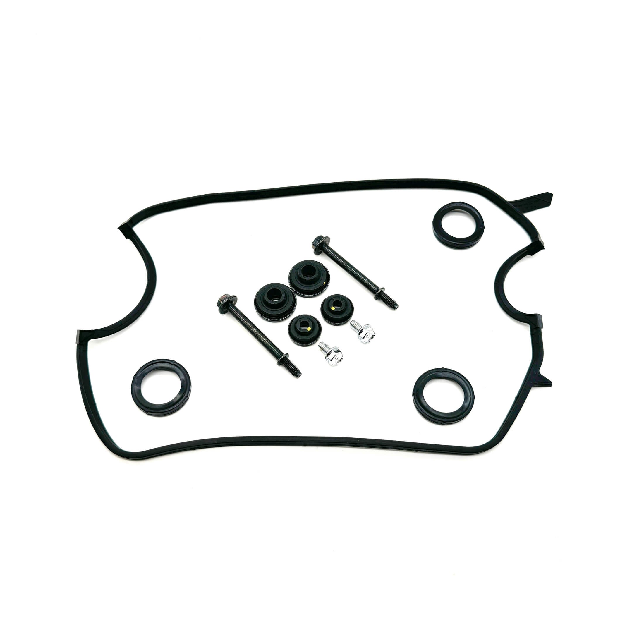 "Set of bolts and seals alongside a valve cover gasket designed for Honda Acty Van HH3, HH4 - viewed from above on a white surface.
