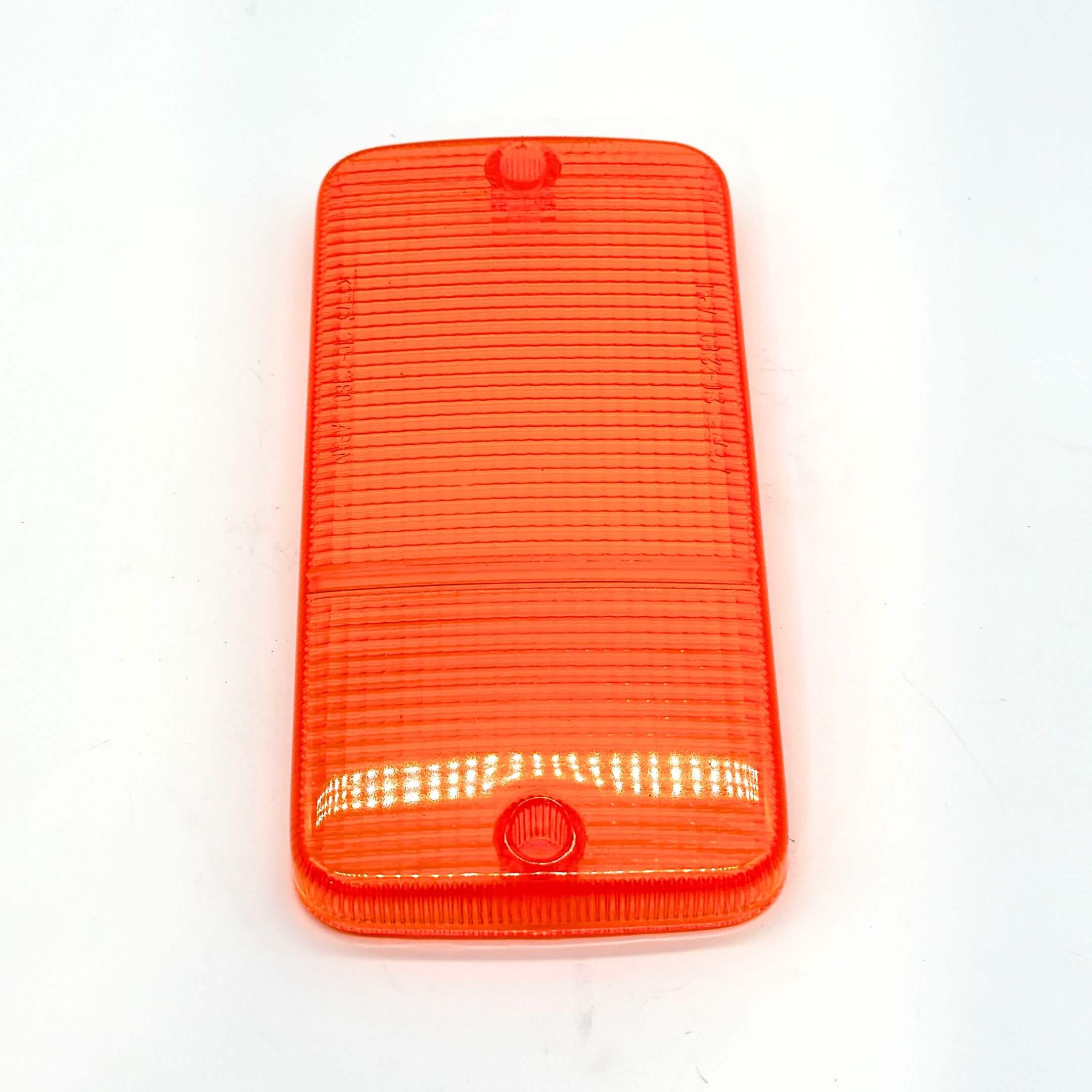 Side profile of the front bumper light lens - left side - in orange, compatible with Honda Acty Van HH1, HH2, HH3, HH4 models (1988-1999), highlighting the lens's consistent color and textured pattern.