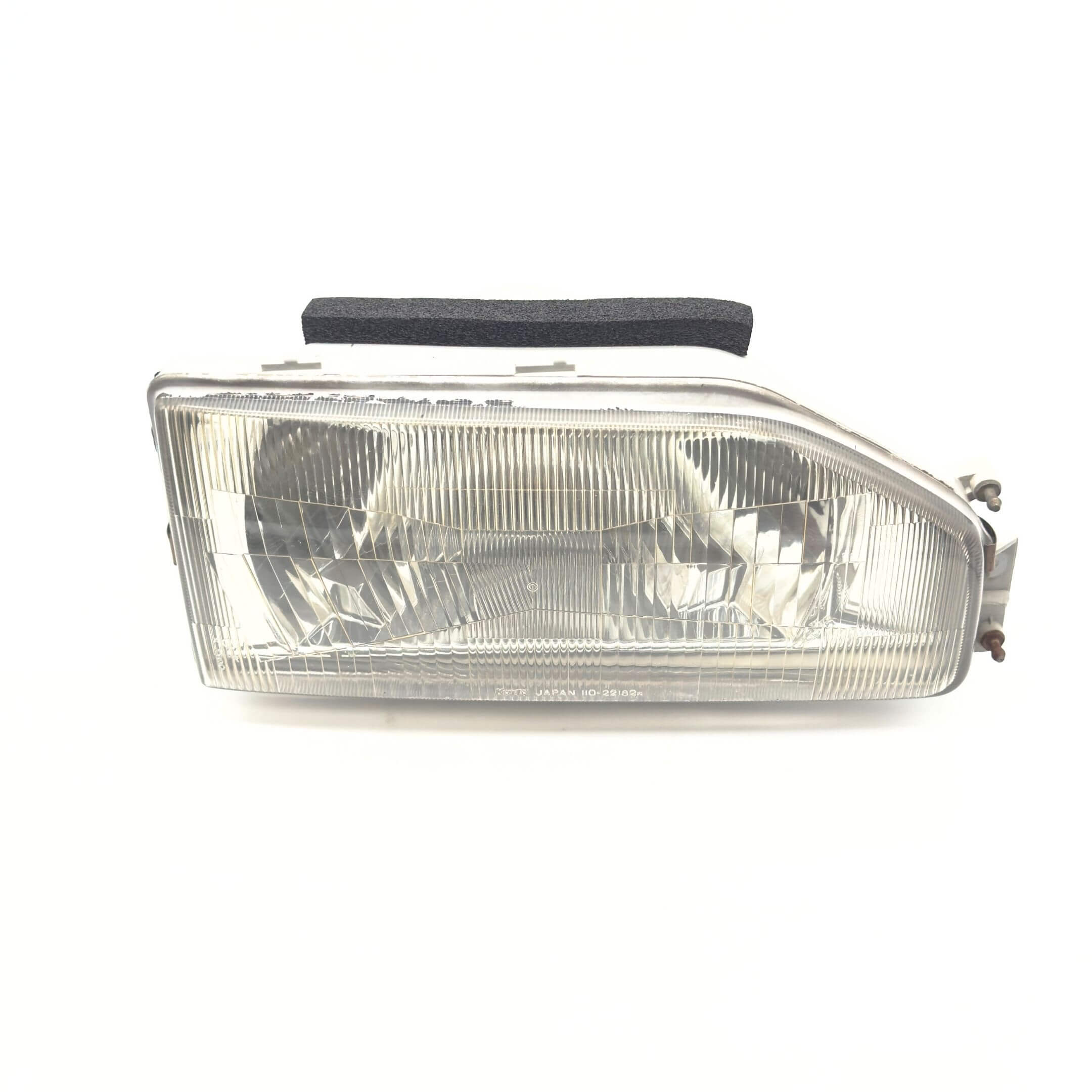 Headlight for Honda Acty Truck Models HA3, HA4 (1990-1993) featuring a clear lens and right/driver side fitment.